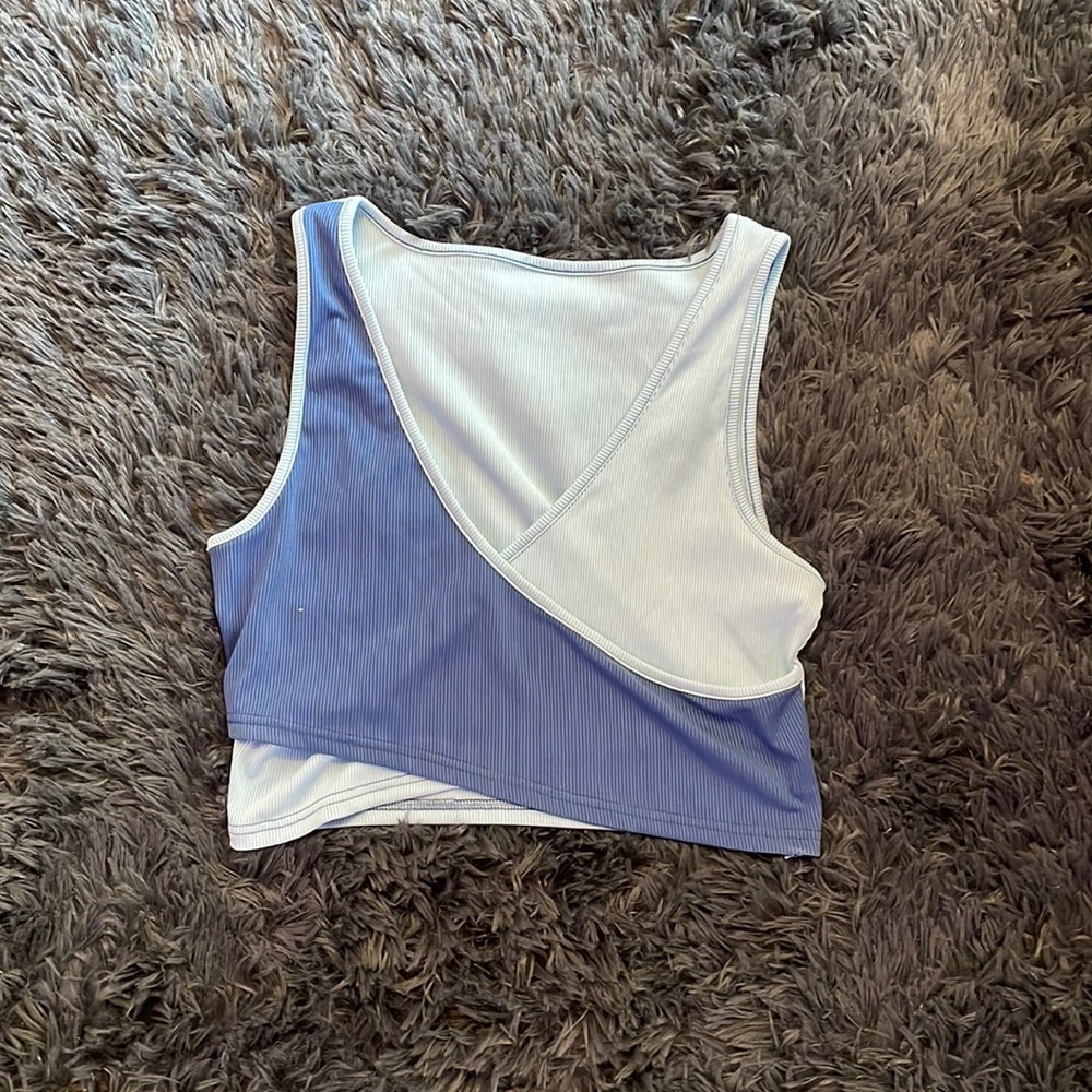 Size large dark and light blue tanked crop top crossover on chest never worn